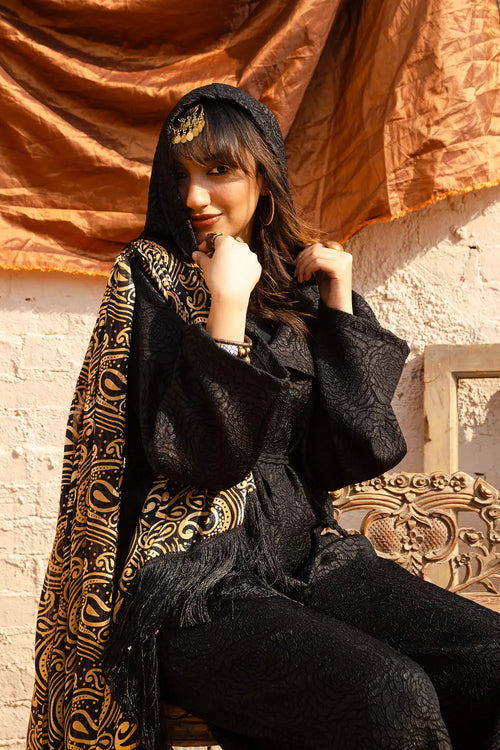 Black jumpsuit with gold shawl